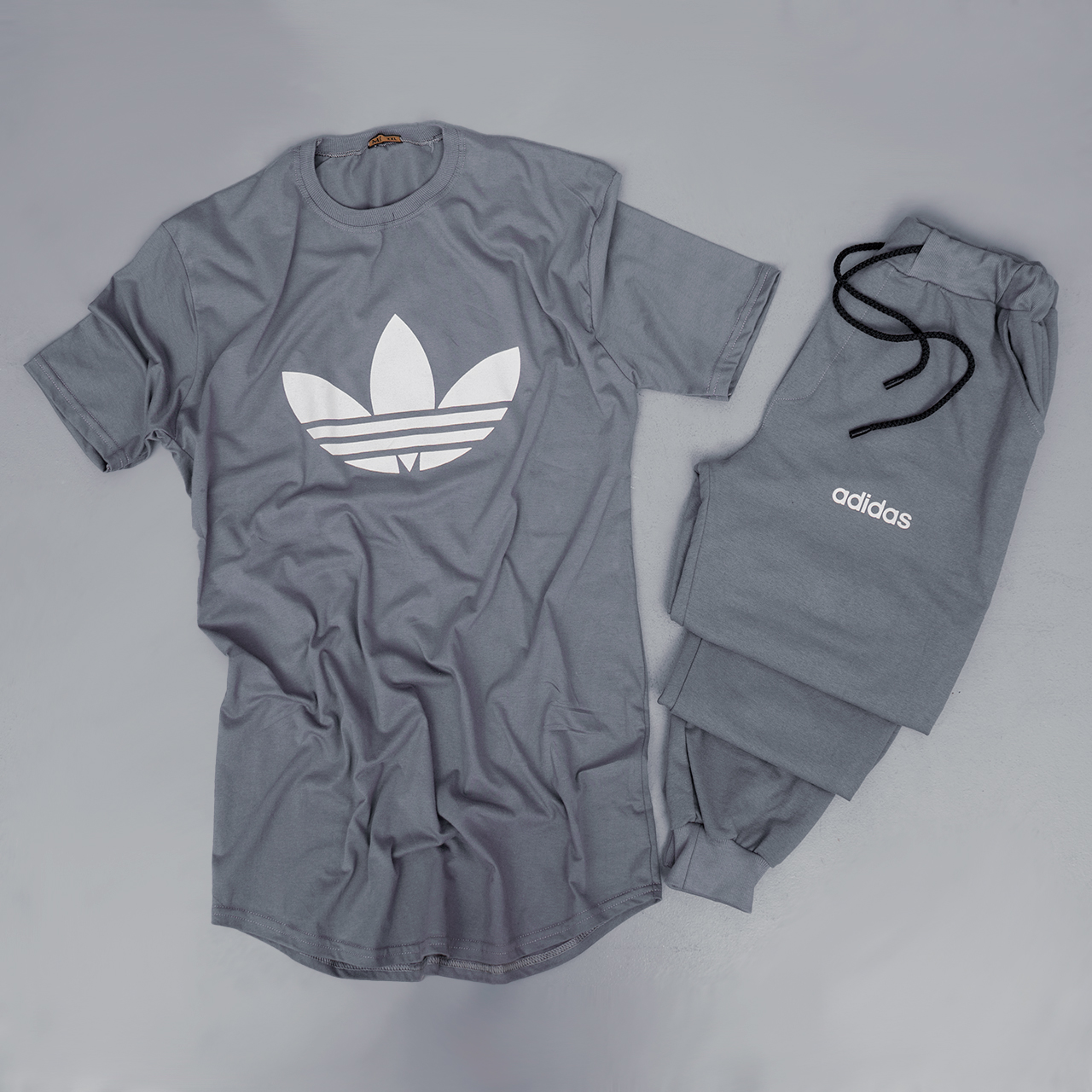 ست تیشرت شلوار مردانه طوسی آدیداس مدل DG110