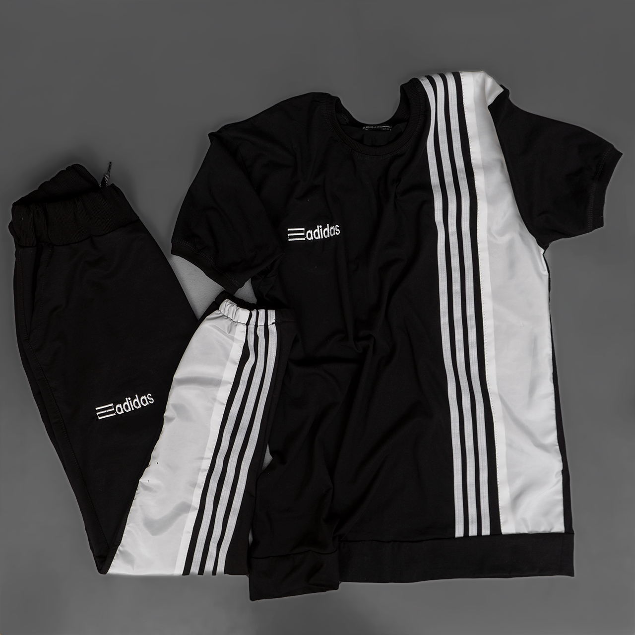 ست تیشرت شلوارآدیداس دورنگ سفید مشکی مردانه مدل b.s